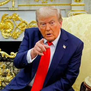 U.S. President Donald Trump points a finger while sitting next to the President of Poland Karol Nawrocki during a meeting in the Oval Office at the White House in Washington, D.C., U.S., September 3, 2025.  REUTERS/Brian Snyder