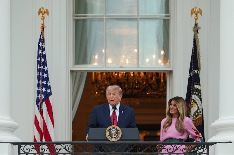 U.S. President Donald Trump speaks next to first lady Melania Trump during the Congressional Picnic at the White House in Washington, D.C., U.S., May 19, 2026.