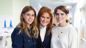 Sarah, Duchess of York with her daughters Princess Beatrice and Princess Eugenie during a visit to the Teenage Cancer Trust unit at University College Hospital, London. Picture date: Wednesday April 23, 2025. (Photo by Aaron Chown/PA Images via Getty Images)
