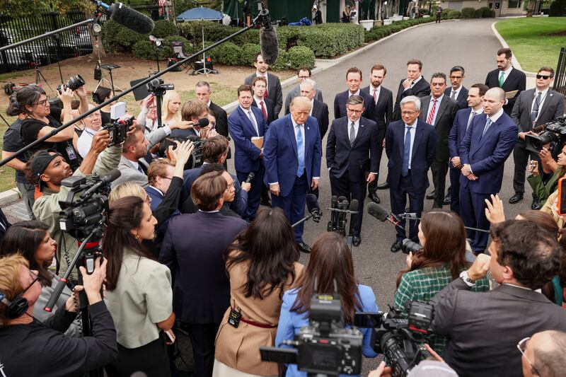 US President Donald Trump, with Meta CEO Mark Zuckerberg, US House Speaker Mike Johnson (R-LA), Nvidia President and CEO Jensen Huang, OpenAI President Greg Brockman, SpacexAI Founder and CEO Elon Musk, and other tech leaders, speaks to the media at the White House driveway following a luncheon for tech leaders in the East Room, in Washington, D.C., US, September 29, 2026. REUTERS/Kevin Lamarque