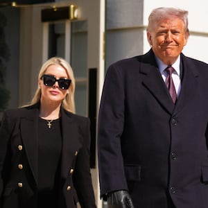White House Press Secretary Karoline Leavitt, pictured with President Donald Trump departing the White House on February 27, 2026, said Trump was monitoring the attack on Iran with his national security team from his Mar-a-Lago resort.