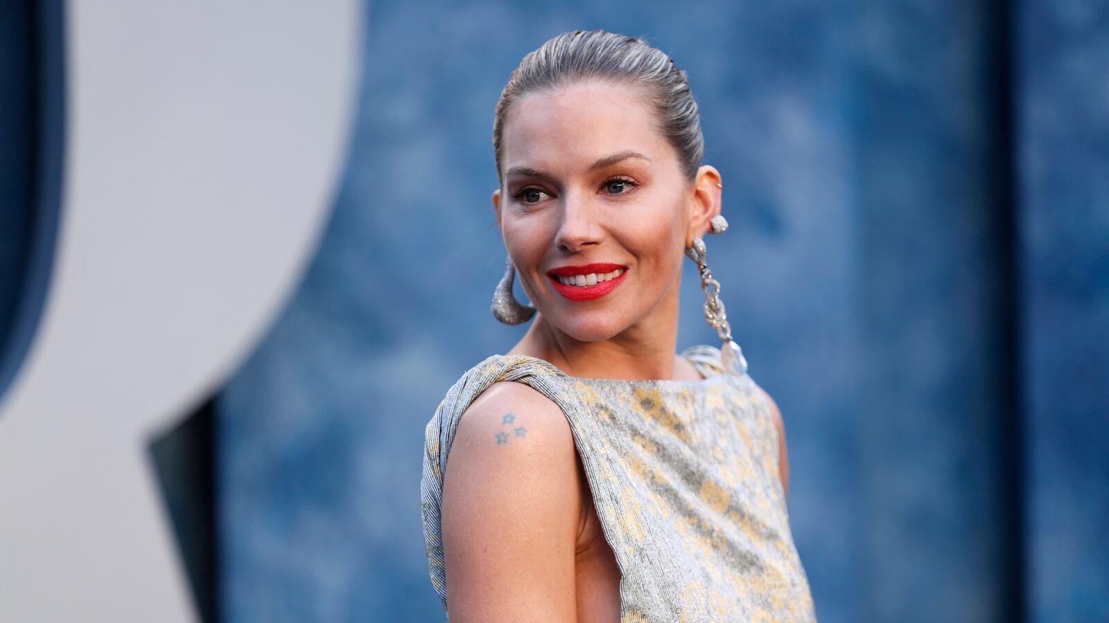 Sienna Miller arrives at the Vanity Fair Oscar party during the 95th Academy Awards, known as the Oscars, in Beverly Hills, California