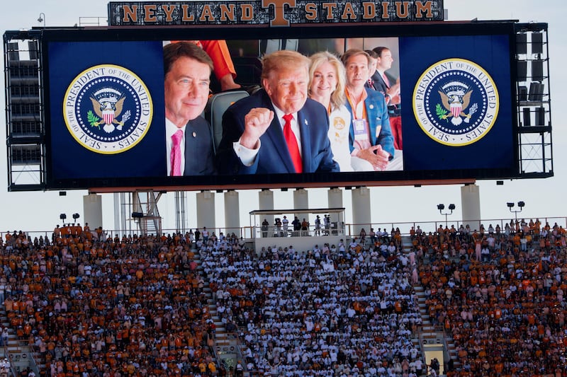 US President Donald Trump on a screen as he attends an NCAA college football game between the University of Texas and the University of Tennessee at Neyland Stadium in Knoxville, Tennessee, US, September 26, 2026. REUTERS/Jonathan Ernst