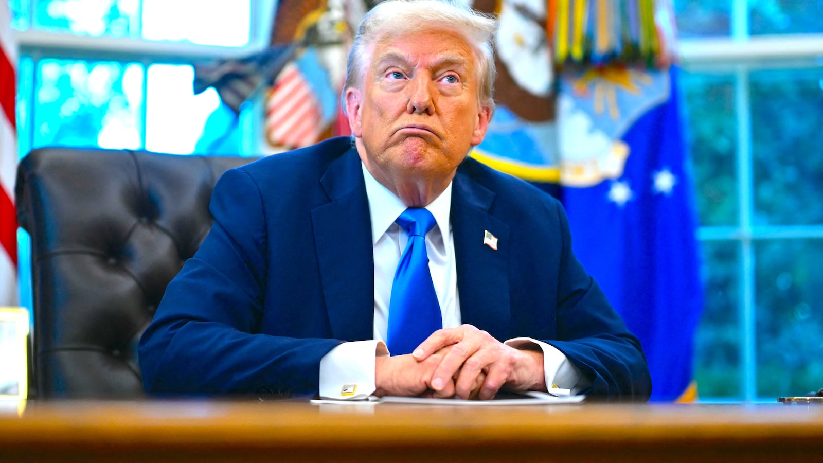 President Donald Trump speaks before signing executive orders in the Oval Office at the White House in Washington, DC, on September 19, 2025.