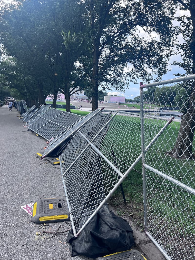 Fencing around the perimeter of the pool has toppled over.