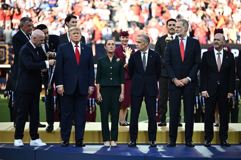 U.S. President Donald Trump, Mexican President Claudia Sheinbaum, Canada's Prime Minister Mark Carney, and FIFA President Gianni Infantino during the trophy presentation after the match.