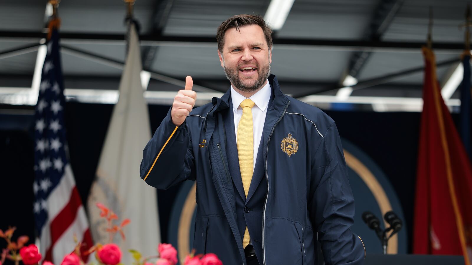 Vice President JD Vance is gifted a jacket during the 2025 Naval Academy Graduation