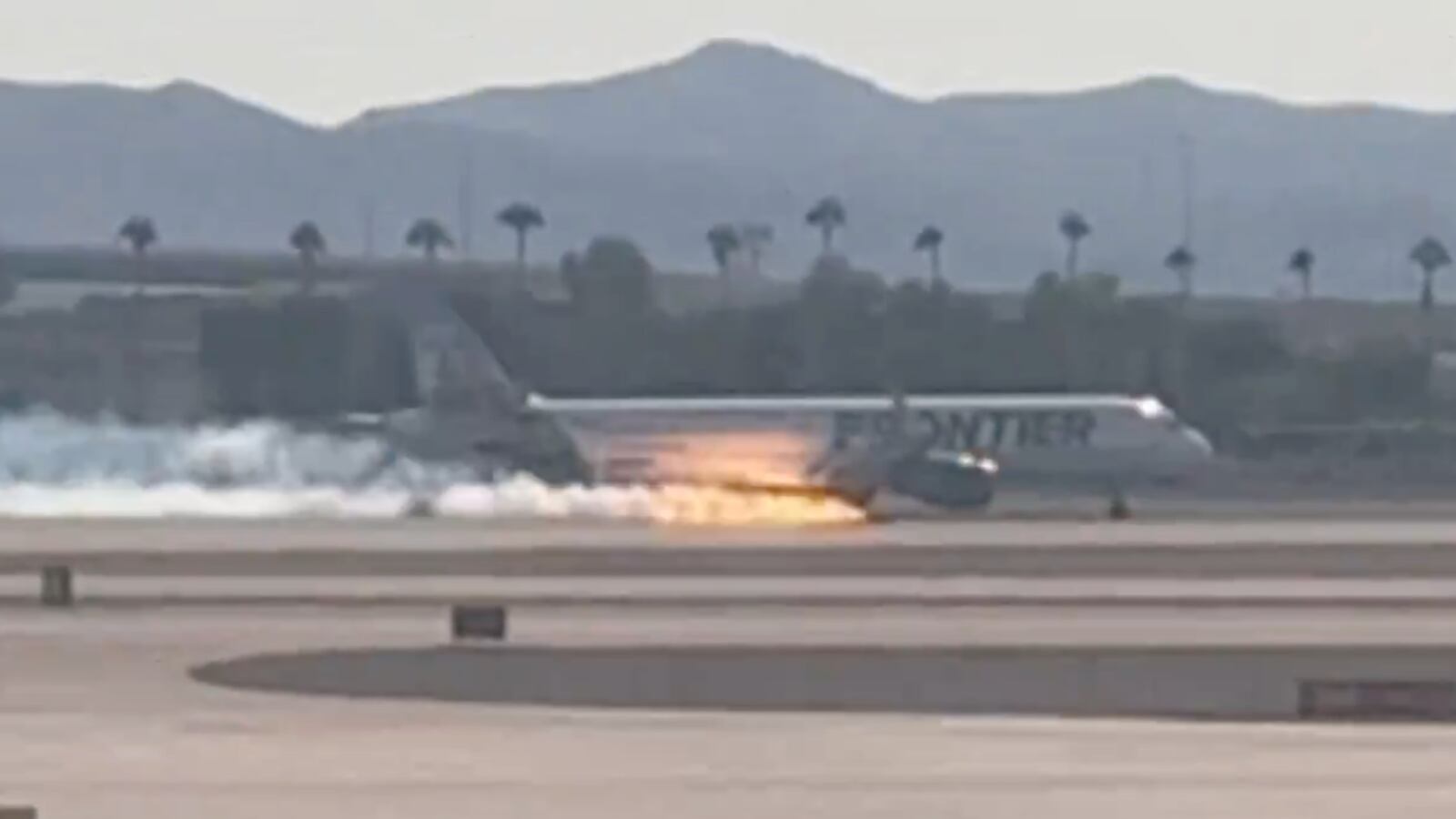 A Frontier Airlines jet was engulfed in flames during an emergency landing in Las Vegas.