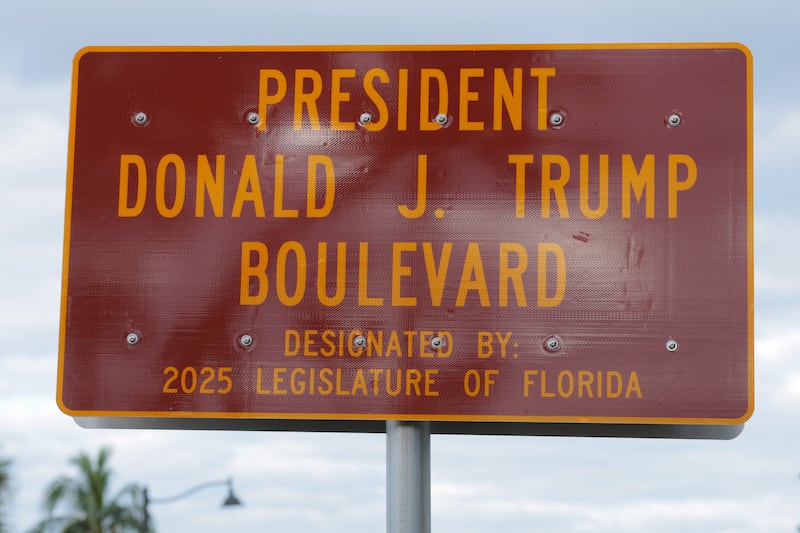 The new sign for "President Donald J. Trump Boulevard" is seen across the street from Mar-a-Lago on January 17, 2026 in Palm Beach, Florida.