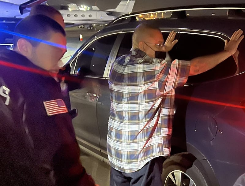 Moises Rivera-Luna being detained.