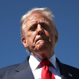 WEST PALM BEACH, FLORIDA - OCTOBER 31: US President Donald Trump speaks to reporters as he arrives at Palm Beach International Airport on October 31, 2025 in West Palm Beach, Florida. Trump is spending the weekend at his Mar-A-Lago estate in Palm Beach, Florida. (Photo by Samuel Corum/Getty Images)