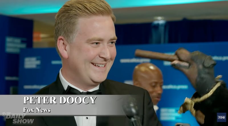 Peter Doocy and Triumph the Insult Comic Dog.