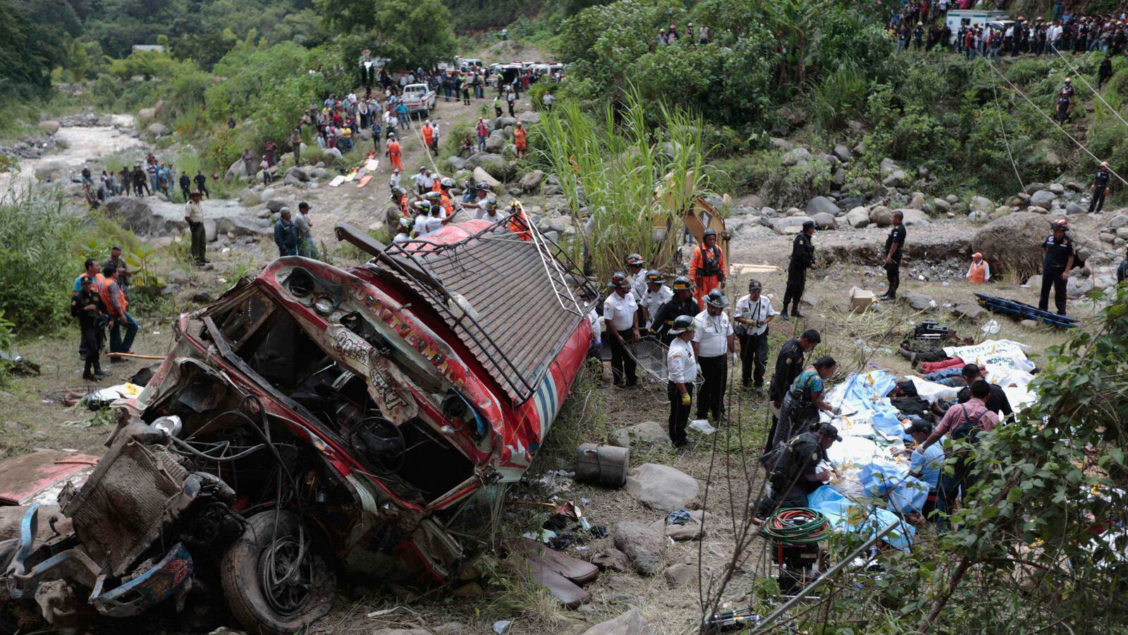 cheats/2013/09/09/bus-drops-660-feet-off-guatemala-cliff/130909-bus-crash-cheat_eocld2