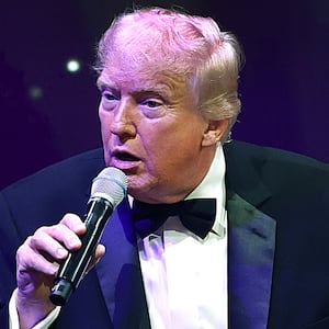 President Donald Trump speaks to guests during a New Year’s Eve event at his Mar-a-Lago home on December 31, 2025 in Palm Beach, Florida.