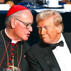 Donald Trump speaks with Archbishop of New York Timothy M. Dolan at the 79th Annual Alfred E. Smith Memorial Foundation Dinner at the Hilton Midtown in New York, October 17, 2024.