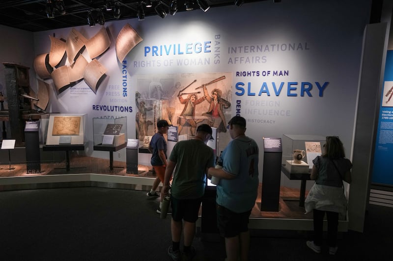 People view displays at the Smithsonian National Museum of African American History & Culture in Washington, D.C., U.S., July 25, 2026.