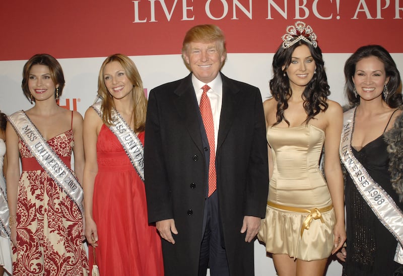 Donald Trump with former Miss Universes and the current Miss Universe, Natalie Glebova
