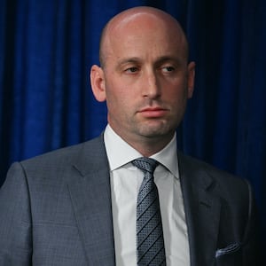 White House Deputy Chief of Staff Stephen Miller looks on as President Donald Trump speaks to the press following US military actions in Venezuela, at his Mar-a-Lago residence in Palm Beach, Florida, on January 3, 2026.