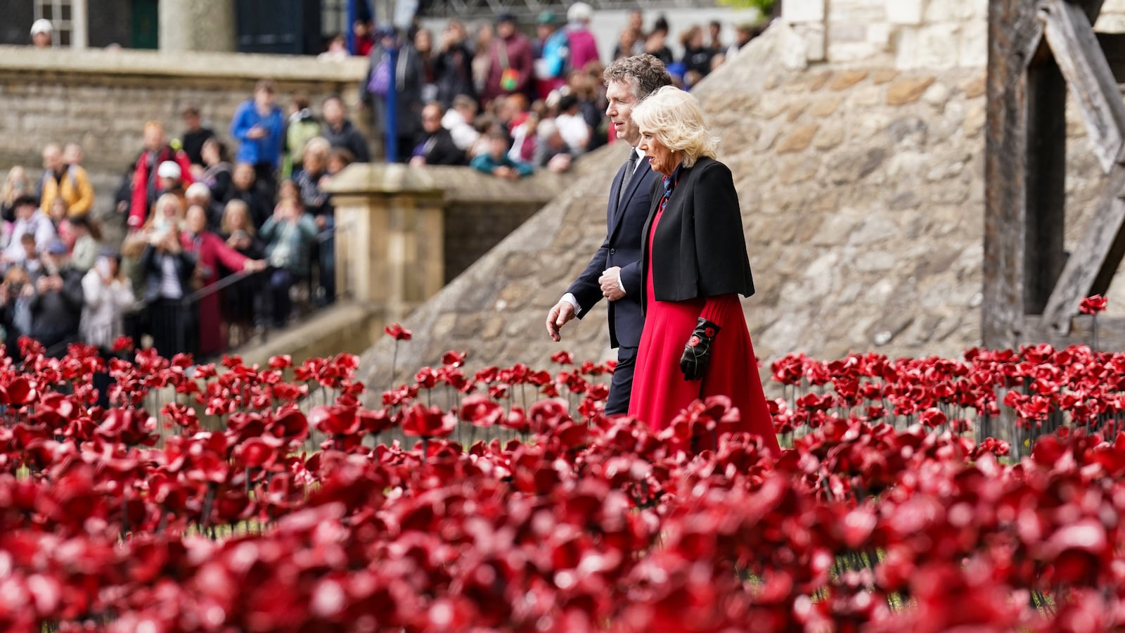 Queen Camilla visits the new display of ceramic poppies, called The Tower Remembers, at the Tower of London on May 06, 2025