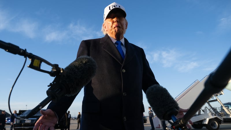 US President Donald Trump speaks to reporters before boarding Air Force One as he departs Joint Base Andrews in Maryland on March 13, 2026. President Trump is heading to Florida to spend the weekend at his Mar-a-Lago resort. (Photo by SAUL LOEB / AFP via Getty Images)