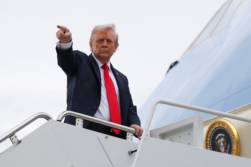 JOINT BASE ANDREWS, MARYLAND - SEPTEMBER 16: U.S. President Donald Trump gestures as he and first lady Melania Trump board Air Force One on September 16, 2025 in Joint Base Andrews, Maryland. President Trump and the first lady are traveling to the United Kingdom where they are expected to meet with King Charles III and Queen Camilla at Windsor Castle and British Prime Minister Keir Starmer. (Photo by Anna Moneymaker/Getty Images)