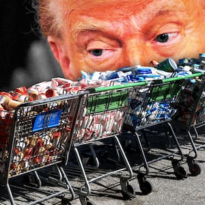 Donald Trump looking over shopping carts filled with food donations