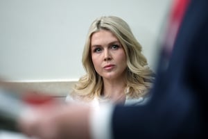 White House Press Secretary Karoline Leavitt listens as U.S. President Donald Trump speaks during a press briefing in the James S. Brady Press Briefing Room of the White House on January 20, 2026 in Washington, DC.