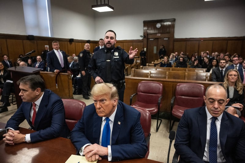 Donald Trump looks on at Manhattan Criminal Court during his trial for covering up hush money payments linked to extramarital affairs in New York on April 22, 2024.
