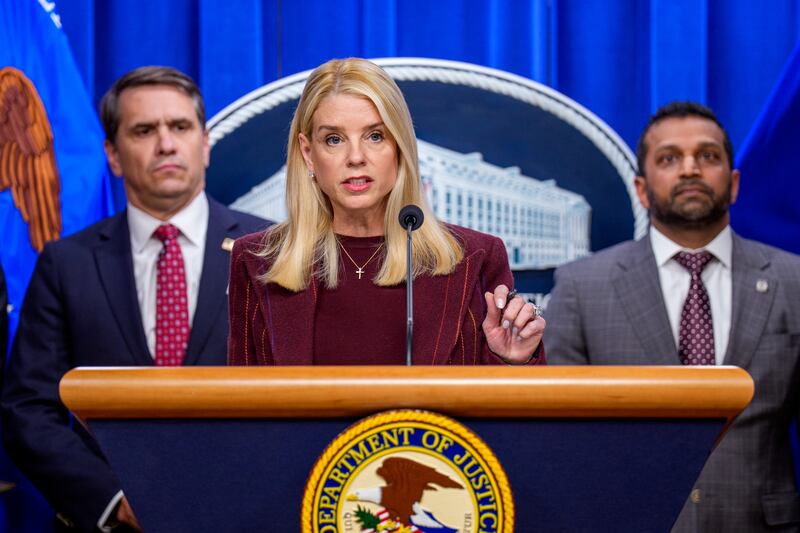 WASHINGTON, DC - NOVEMBER 19: Attorney General Pam Bondi, accompanied by Deputy Attorney General Todd Blanche (L) and FBI Director Kash Patel (R), speaks during a news conference at the Justice Department on November 19, 2025 in Washington, DC. The Justice Department announced a fifteen-million-dollar reward for information leading to the arrest of Ryan James Wedding, the leader of an international criminal drug organization who smuggled large quantities of cocaine through Colombia and Mexico for distribution in the United States and Canada. (Photo by Andrew Harnik/Getty Images)