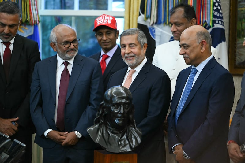 Micron CEO Sanjay Mehrotra speaks next to IBM CEO Arvind Krishna (R) at a Diwali celebration with US President Donald Trump and Indian American leaders in the Oval Office