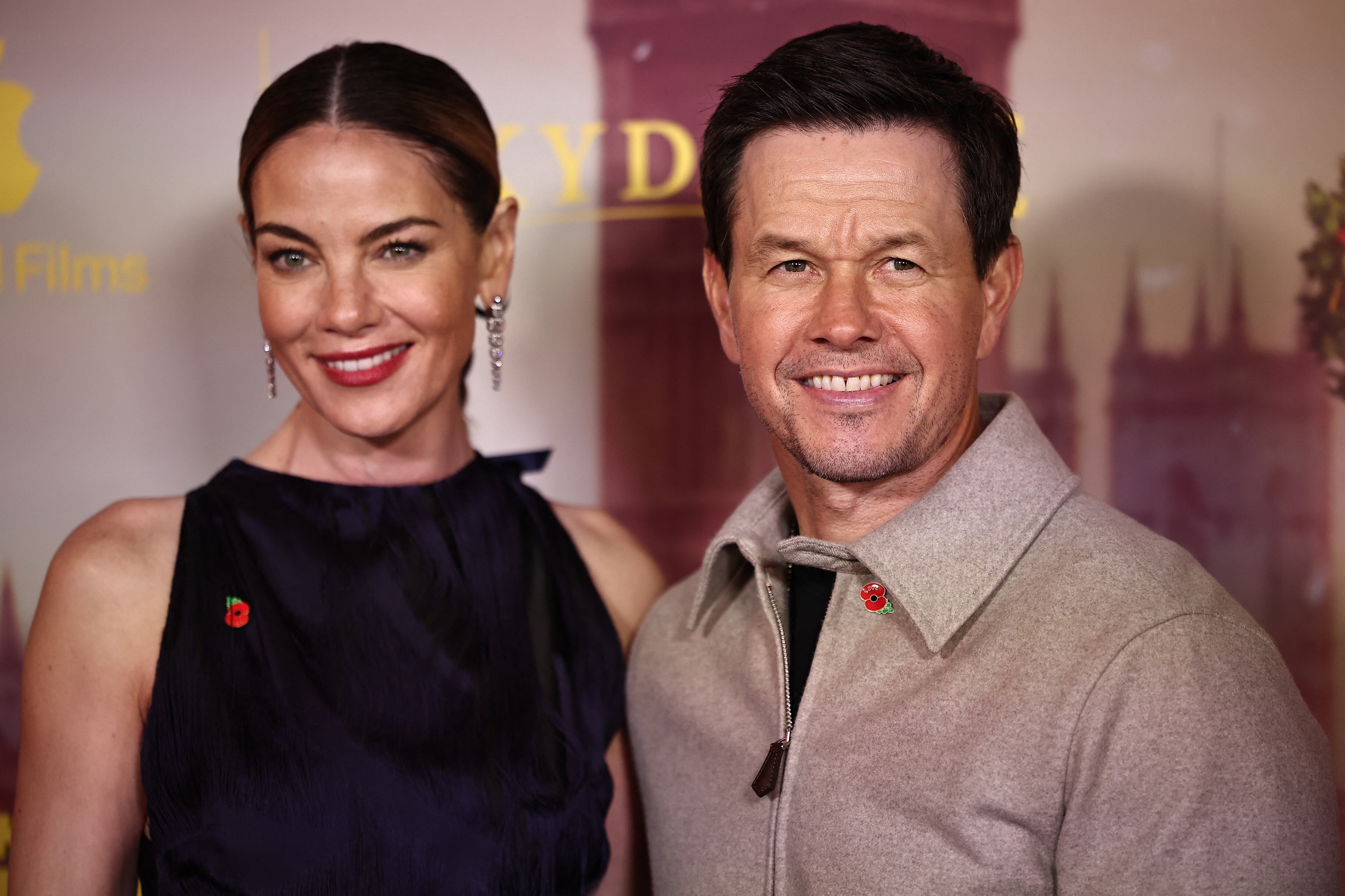 Michelle Monaghan and US actor Mark Wahlberg pose on the red carpet