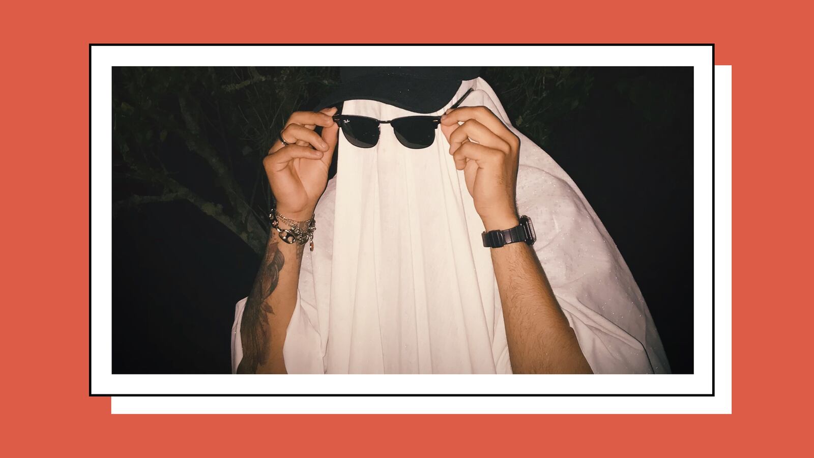 Man dressed as a ghost with sunglasses.