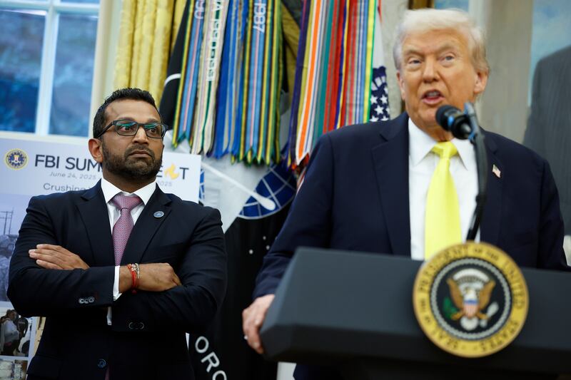 WASHINGTON, DC - OCTOBER 15: Federal Bureau of Investigation Director Kash Patel (L) looks on as U.S. President Donald Trump speaks during a press conference in the Oval Office of the White House on October 15, 2025 in Washington, DC. Trump and Patel provided an update on the Trump administration’s progress in reducing violent crime. (Photo by Kevin Dietsch/Getty Images)