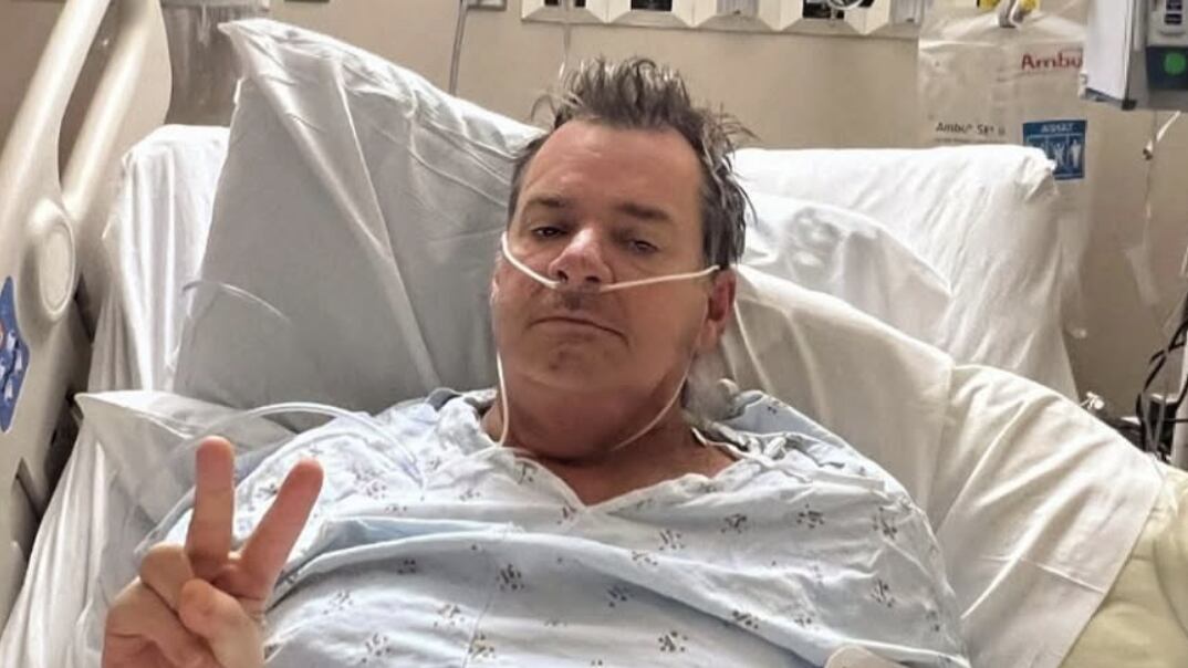 David Roach in hospital bed.