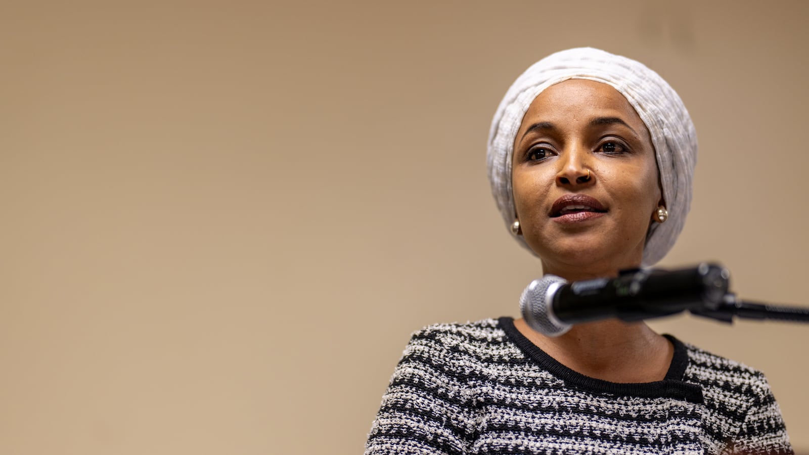 U.S. Rep. Ilhan Omar (D-MN) speaks during a town hall meeting at the Urban League Twin Cities facility on January 27, 2026 in Minneapolis, Minnesota. A person holding a syringe charged the podium as Omar spoke.