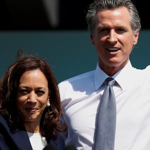 Kamala Harris and Gavin Newsom wave after Newsom's appearance ahead of the Republican-led recall election in September, in San Leandro, California, U.S., September 8, 2021.