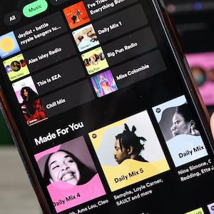 NEW YORK, NEW YORK - JUNE 04: In this photo illustration, the Spotify music app is seen on a phone on June 04, 2024 in New York City. Spotify made an announcement that it will be raising the price of its Spotify Premium Individual plan by $1, from $10.99 to $11.99 per month and the Premium Family plan by $3, from $16.99 to $19.99 per month. (Photo Illustration by Michael M. Santiago/Getty Images)