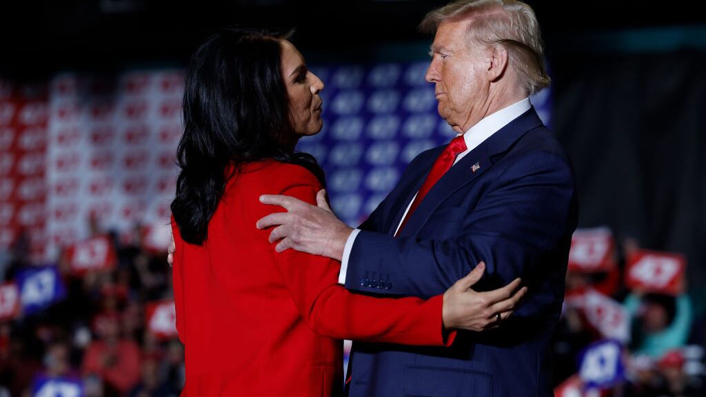 Former U.S. Representative from Hawaii Tulsi Gabbard and Republican presidential nominee, former U.S. President Donald Trump embrace during a campaign rally at the Greensboro Coliseum on Oct. 22, 2024, in Greensboro, North Carolina.