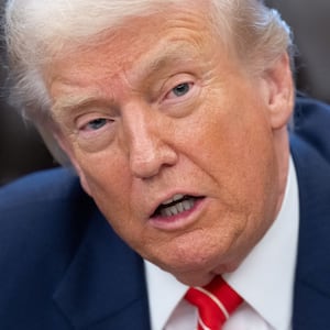 US President Donald Trump speaks with the media after signing a funding bill to end a partial government shutdown in the Oval Office of the White House in Washington, DC, February 3, 2026.