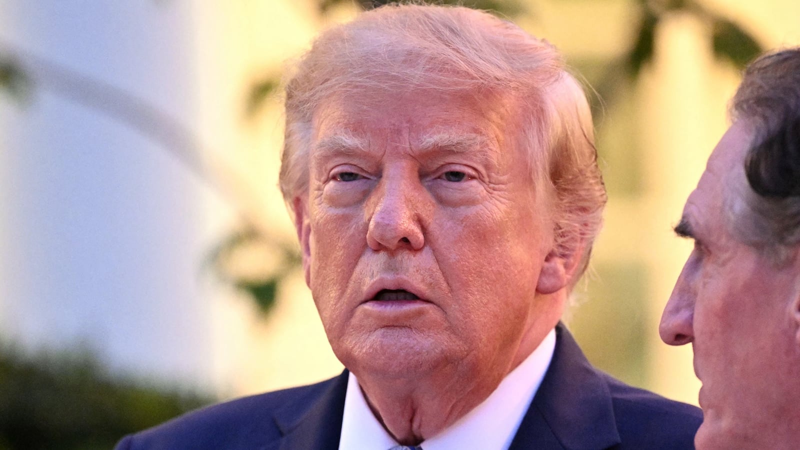 US President Donald Trump speaks with the US Secretary of the Interior Doug Burgum during a Rose Garden dinner at the White House in Washington, DC, on September 17, 2026. (Photo by Mandel NGAN / AFP via Getty Images)