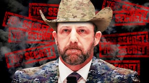 A photo illustration of Markwayne Mullin in camouflage, cowboy hat, and top secret stamps.