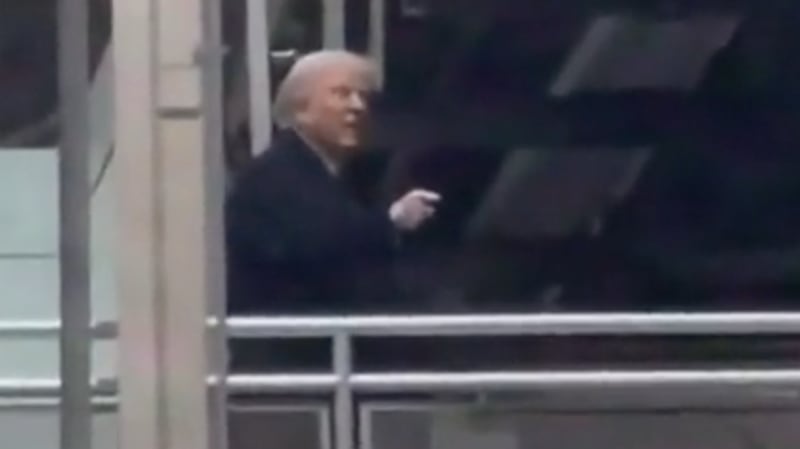 Donald Trump points and flips the bird at someone who called him a "pedophile protector" in Michigan.
