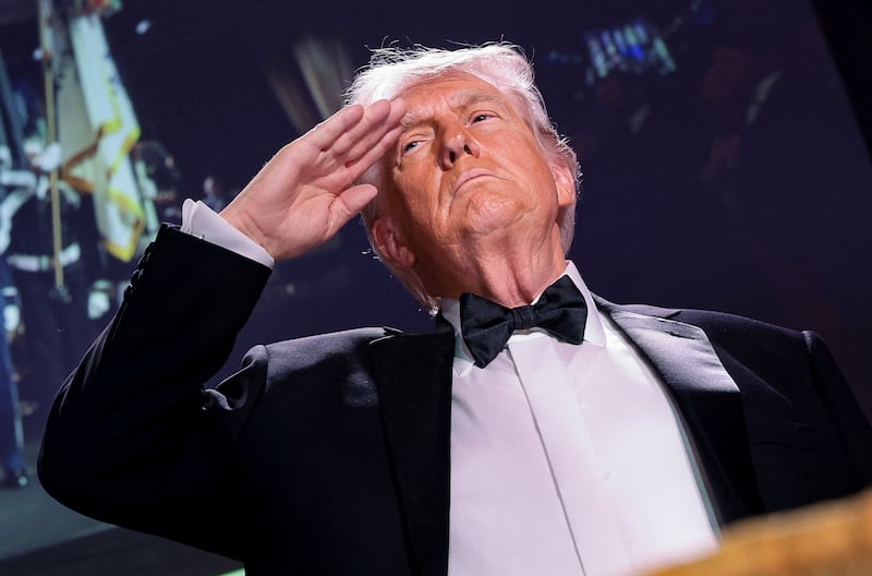 U.S. President Donald Trump salutes during the annual White House Correspondents' Association dinner in Washington, D.C., U.S., April 25, 2026.