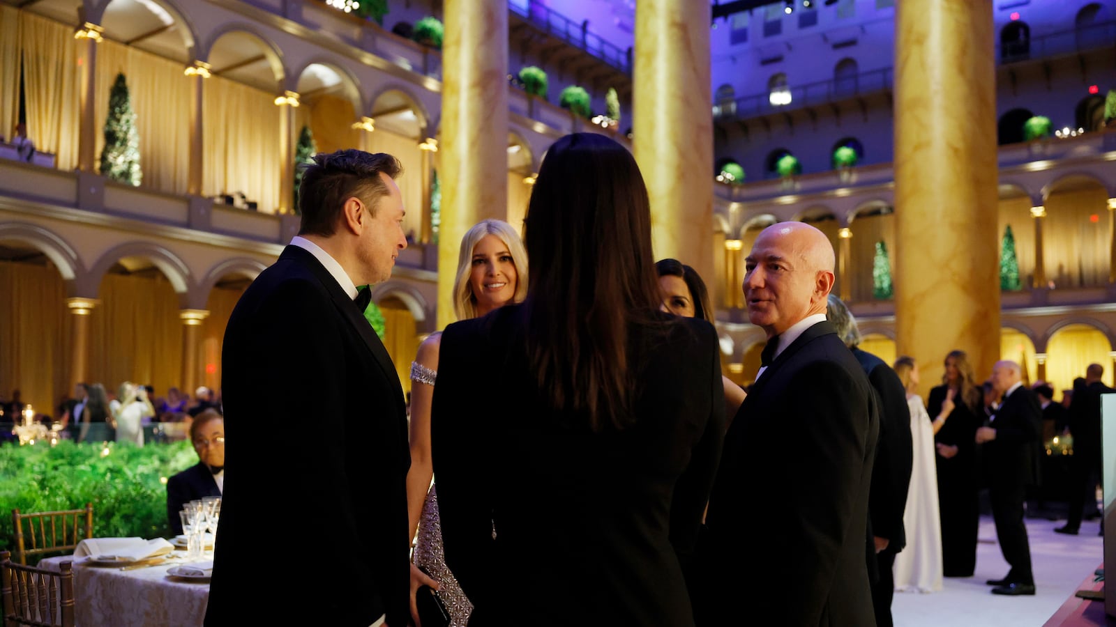WASHINGTON, DC - JANUARY 19: (L-R) Elon Musk, Ivanka Trump, and Jeff Bezos speak to one another at a candlelight dinner for U.S. President-elect Donald Trump at the National Building Museum on January 19, 2025 in Washington, DC. Trump will be sworn in as the 47th U.S. president on January 20. (Photo by Anna Moneymaker/Getty Images)