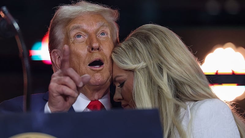 Erika Kirk joins U.S. President Donald Trump onstage during the memorial service for political activist Charlie Kirk at State Farm Stadium on September 21, 2025 in Glendale, Arizona. Kirk, the CEO and co-founder of Turning Point USA, was shot and killed on September 10th while speaking at an event during his "American Comeback Tour" at Utah Valley University. (Photo by Win McNamee/Getty Images)