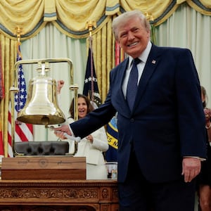 U.S. President Donald Trump rings the opening bell for the New York Stock Exchange (NYSE) and Nasdaq during an event to mark the launch of "Trump Accounts" in the Oval Office at the White House in Washington, D.C., U.S., July 6, 2026. REUTERS/Evan Vucci     TPX IMAGES OF THE DAY