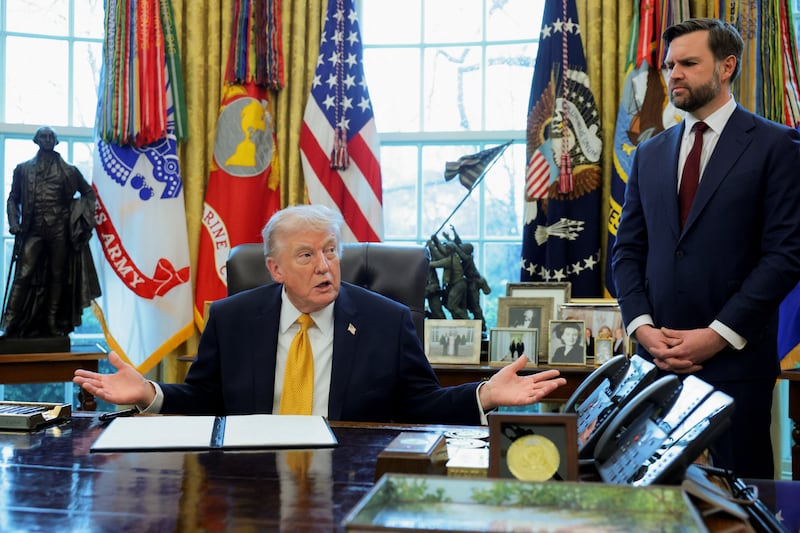 President Donald Trump, next to Vice President JD Vance, speaks during an event to sign an executive order creating an anti‑fraud task force headed by Vance, in the Oval Office at the White House in Washington, D.C., U.S., March 16, 2026.