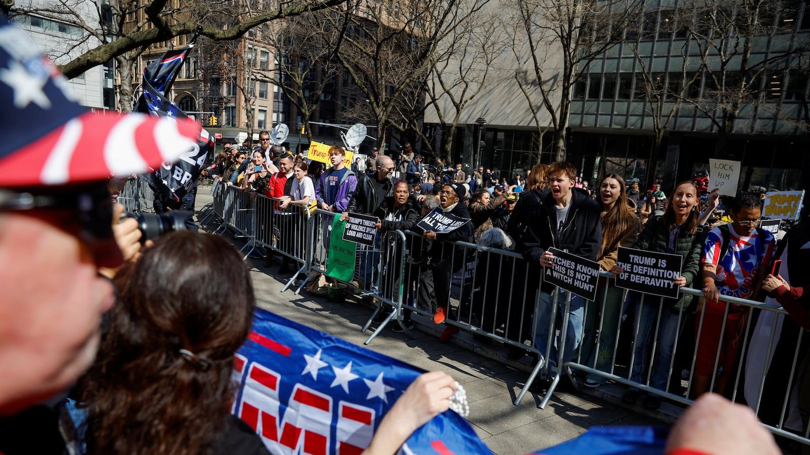 Anti-Trump protesters demonstrate facing Trump supporters outside Manhattan Criminal Courthouse.