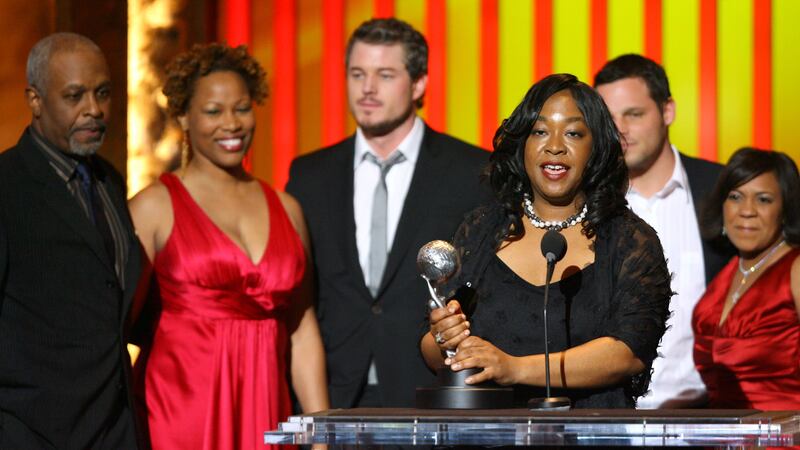 Shonda Rhimes, producer, winner Outstanding Drama Series for "Grey's Anatomy" (holding trophy), with James Pickens Jr., Zoanne Clack, Eric Dane, Justin Chambers and Chandra Wilson