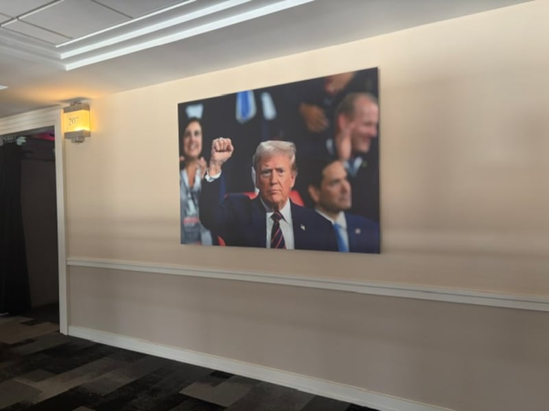 An image of Trump at the 2024 convention hanging inside the American Airlines Center in Dallas.